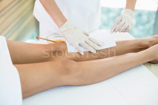 Woman receiving hot wax treatment  Stock photo © wavebreak_media