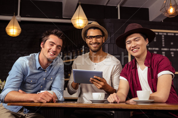 Friends using a tablet Stock photo © wavebreak_media