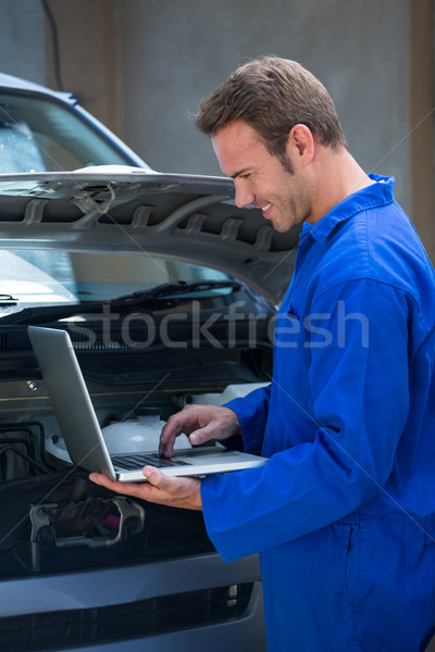 Mechanic using a laptop Stock photo © wavebreak_media