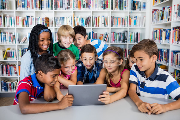 Front view of pupils using tablet pc Stock photo © wavebreak_media
