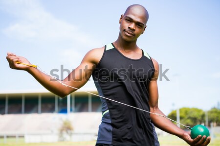 Portrait of athlete holding hammer throw Stock photo © wavebreak_media