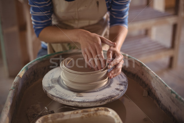 Mid section of female potter making pot Stock photo © wavebreak_media