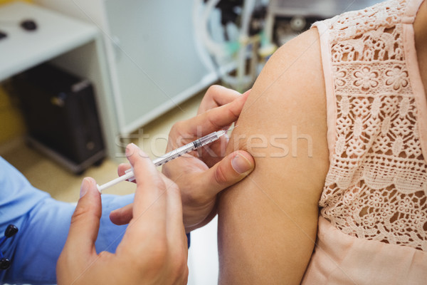 Close-up of male doctor giving an injection to a patient Stock photo © wavebreak_media