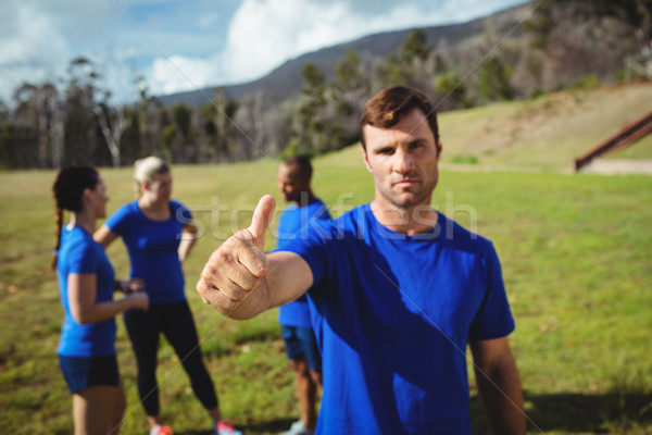 Fit man showing thumbs up in bootcamp Stock photo © wavebreak_media