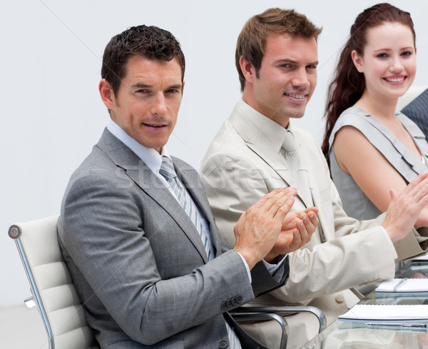 Attractive businessman applauding in a meeting Stock photo © wavebreak_media