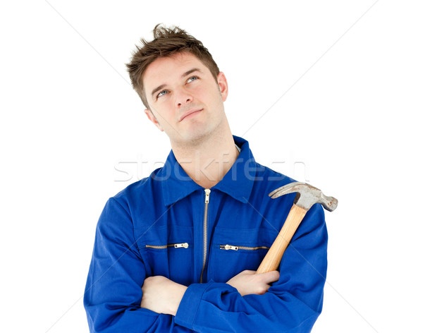Thoughtful male worker holding a hammer against white background Stock photo © wavebreak_media