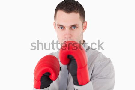 Businessman ready to fight against a white background Stock photo © wavebreak_media