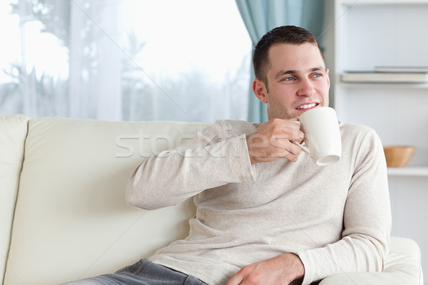 Vonzó férfi tea nappali kávé televízió Stock fotó © wavebreak_media