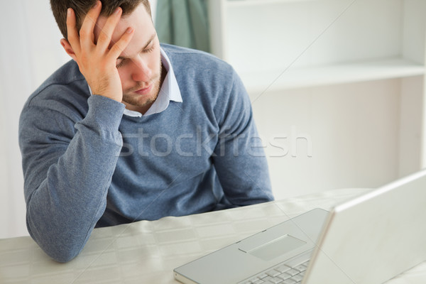 Young businessman almost falling asleep in his homeoffice Stock photo © wavebreak_media