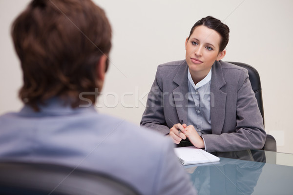Young businesswoman listening to her business partner Stock photo © wavebreak_media