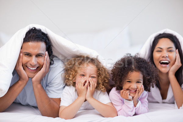 Neşeli genç aile gizleme battaniye mutlu Stok fotoğraf © wavebreak_media