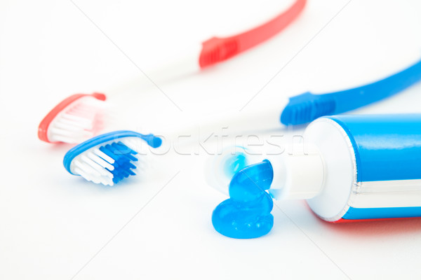Two toothbrushes next to a tube of toothpaste Stock photo © wavebreak_media