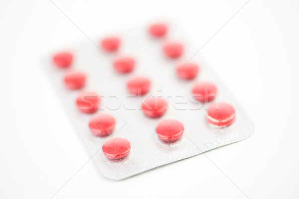 Red medications against white background Stock photo © wavebreak_media