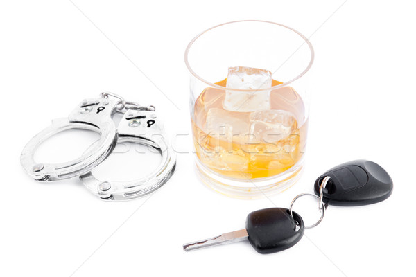 Handcuff a whiskey and a car key Stock photo © wavebreak_media