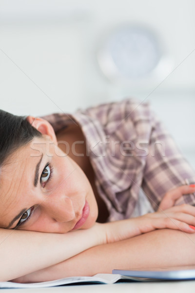 Woman leaning on the table with arms crossed in living room Stock photo © wavebreak_media