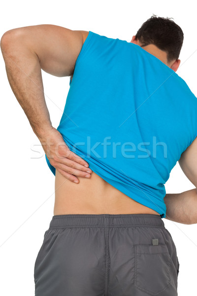 Vista posteriore uomo abbigliamento sportivo sofferenza mal di schiena giovane Foto d'archivio © wavebreak_media