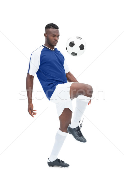 Football player in blue jersey controlling ball Stock photo © wavebreak_media