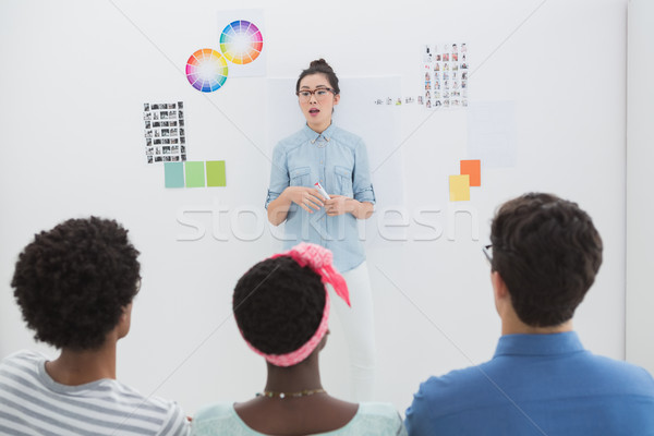 Young creative team listening to presentation Stock photo © wavebreak_media