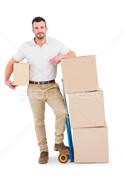 Delivery man with trolley of boxes Stock photo © wavebreak_media
