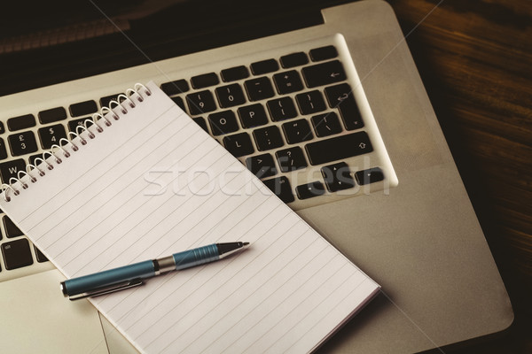 Notepad laptop desk business ufficio pen Foto d'archivio © wavebreak_media