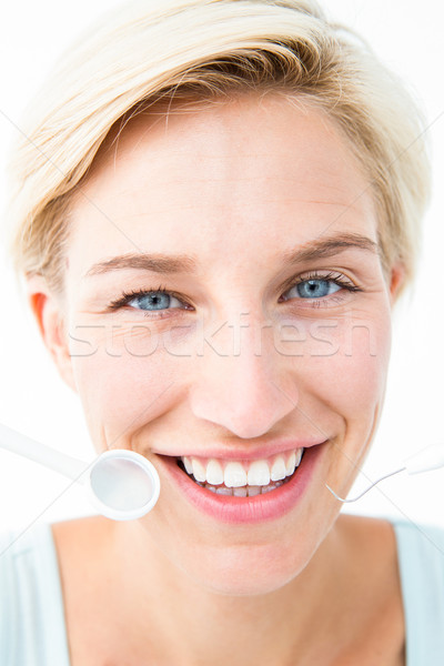 Csinos nő tart fogászati szerszámok fehér mosoly Stock fotó © wavebreak_media