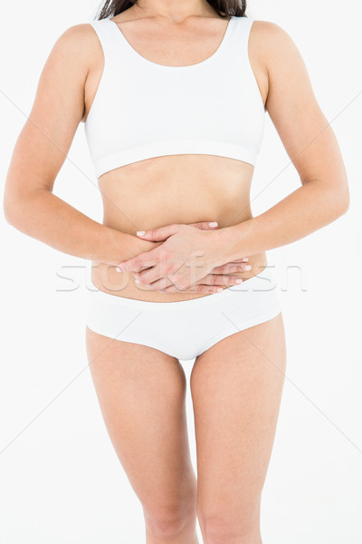 Fit woman suffering stomach pain  Stock photo © wavebreak_media