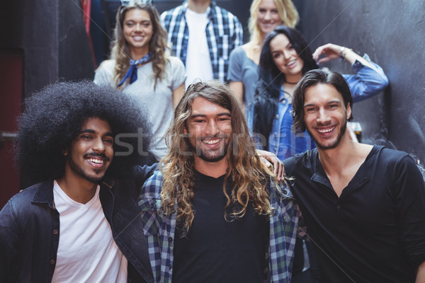 Portrait of smiling friends in room Stock photo © wavebreak_media