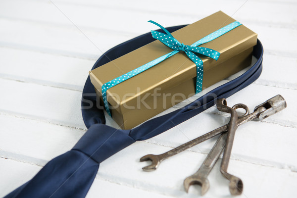 Close up of gift and necktie by work tools Stock photo © wavebreak_media