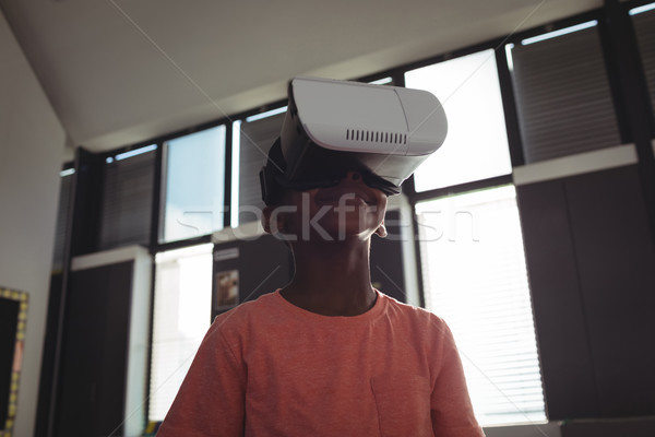 Stock photo: Low angle view of boy wearing virtual reality simulator