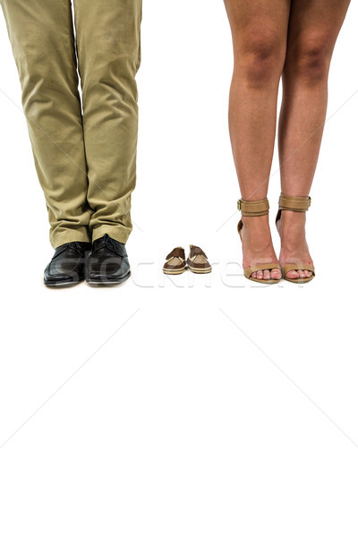 Low section of couple amidst baby footwear Stock photo © wavebreak_media