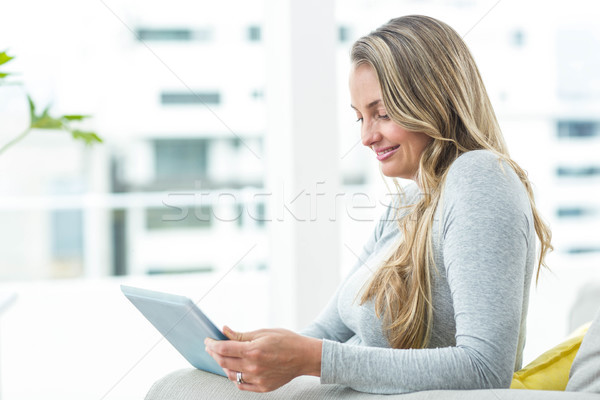 Pregnant woman using digital tablet Stock photo © wavebreak_media