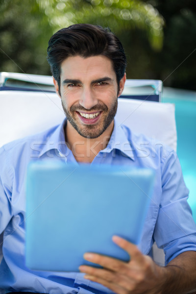 Smart man using digital tablet near pool Stock photo © wavebreak_media