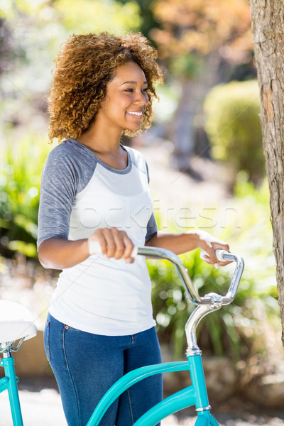 Woman walking with the cycle Stock photo © wavebreak_media