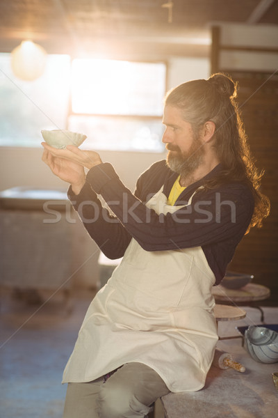 Male potter checking bowl Stock photo © wavebreak_media