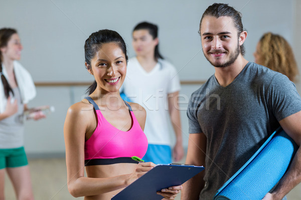 Female trainer helping man on her work out routines Stock photo © wavebreak_media