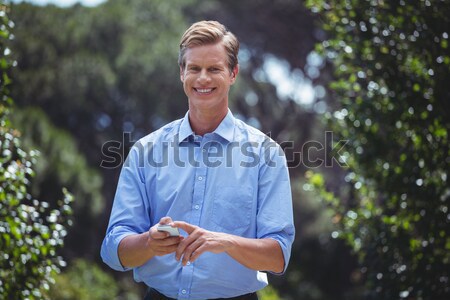 Stock photo: Senior woman holding sweet food