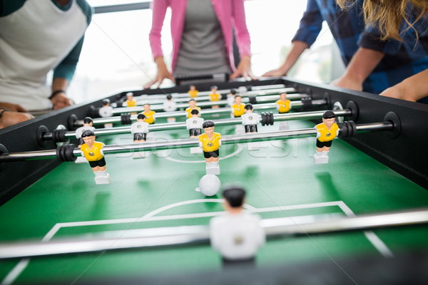 Mid section of executives playing table football Stock photo © wavebreak_media