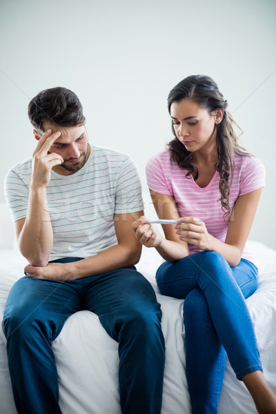 Worried couple finding out results of a pregnancy test in bedroom Stock photo © wavebreak_media