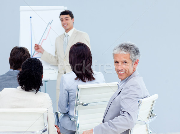 Stockfoto: Volwassen · zakenman · glimlachend · camera · conferentie · collega's