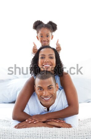 Adorable little girl having fun with her parents  Stock photo © wavebreak_media