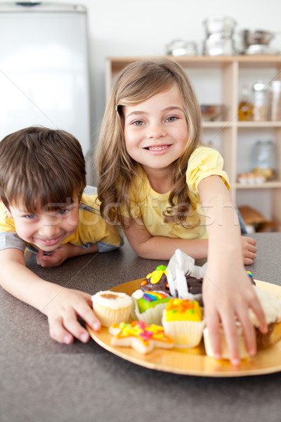 Stock photo: Brother and sister eating cookies