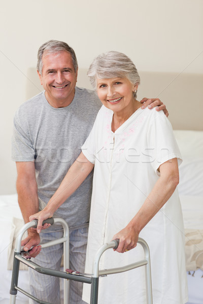 Man helping his wife to walk Stock photo © wavebreak_media