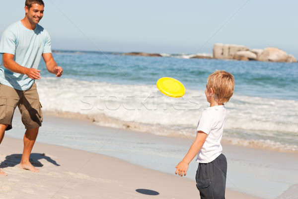 Little boy playing frisbee with his father Stock photo © wavebreak_media