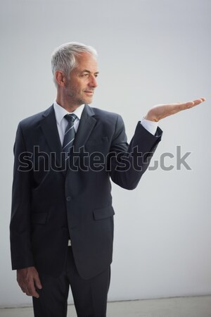 Clueless mature salesman against a white background Stock photo © wavebreak_media