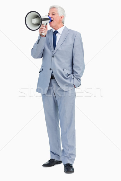 Boss shouting with megaphone against white background Stock photo © wavebreak_media