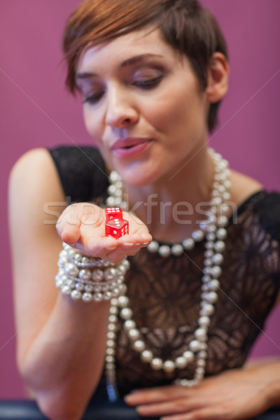 Dice being blown on by woman for luck at casino Stock photo © wavebreak_media