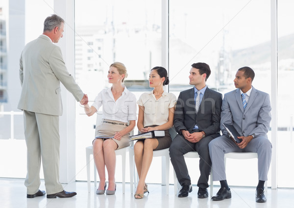 Affaires serrer la main femme personnes attente entretien d'embauche [[stock_photo]] © wavebreak_media