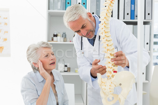 Male doctor explaining the spine to senior patient Stock photo © wavebreak_media