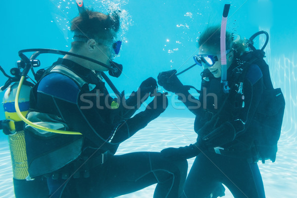 Man proposing marriage to his shocked girlfriend underwater in s Stock photo © wavebreak_media