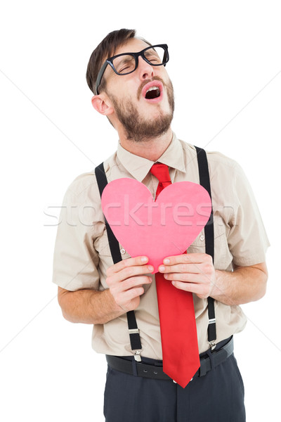 Geeky hipster crying and holding heart card Stock photo © wavebreak_media